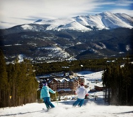 Skiers With Resort View Skiers With Resort View